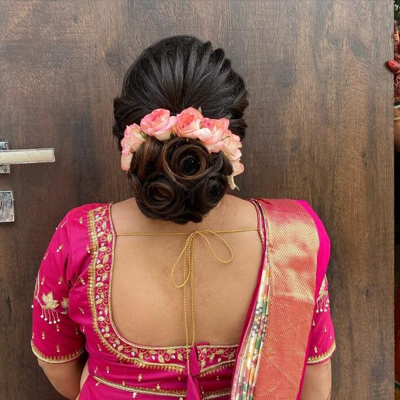 What a beautiful large low bun with real flower gajra Care however should  be taken be  Bridal hair buns Bridal hair decorations Bridal hairstyle  indian wedding