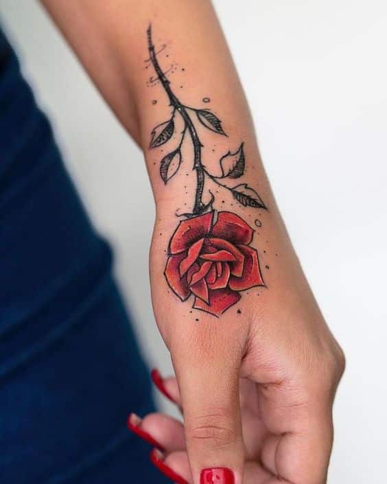 Premium Vector  A hand holding a flower rose and hand tattoo style